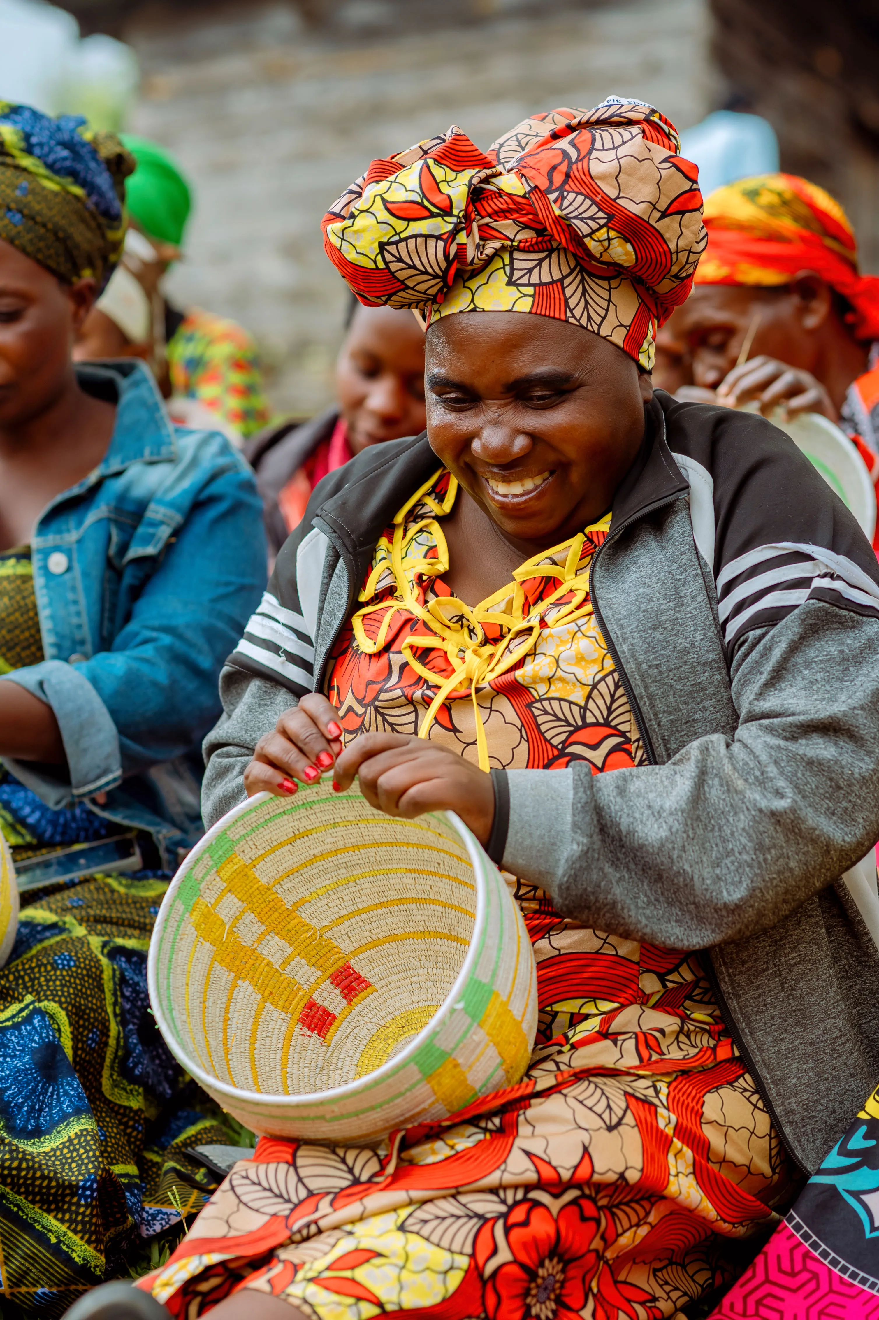 Smiling weaver at work